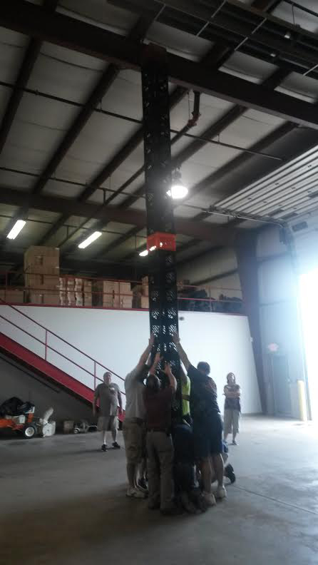 Teamwork is required to build this crate stack